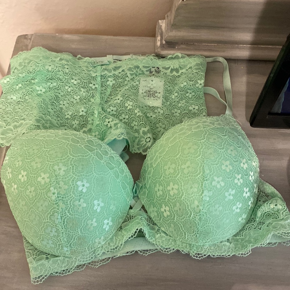 Brand new with tags, Secret Lace LLC Black Fuchsia set in mint green.
